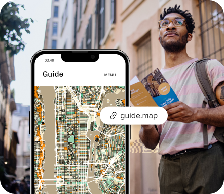 A person looks up beside a phone showing a city map and a guide.map short link.